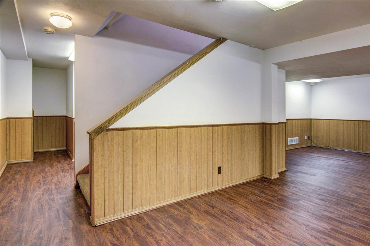 7196 Sentinel Road Rockford, IL 61107 - Photo 22 of 24 a view of a hallway with wooden floor
