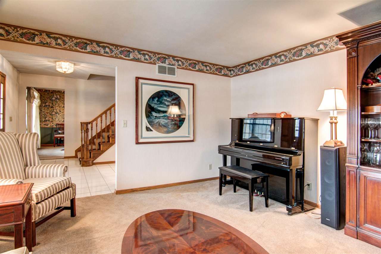 7196 Sentinel Road Rockford, IL 61107 - Photo 3 of 24 a living room with furniture and a flat screen tv