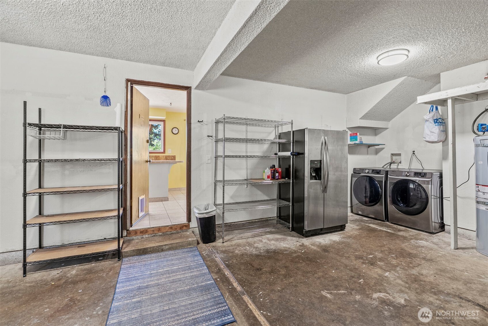 10 Lee Place Longview, WA 98632 - Photo 20 of 27 a view of a storage & utility room with washer and dryer