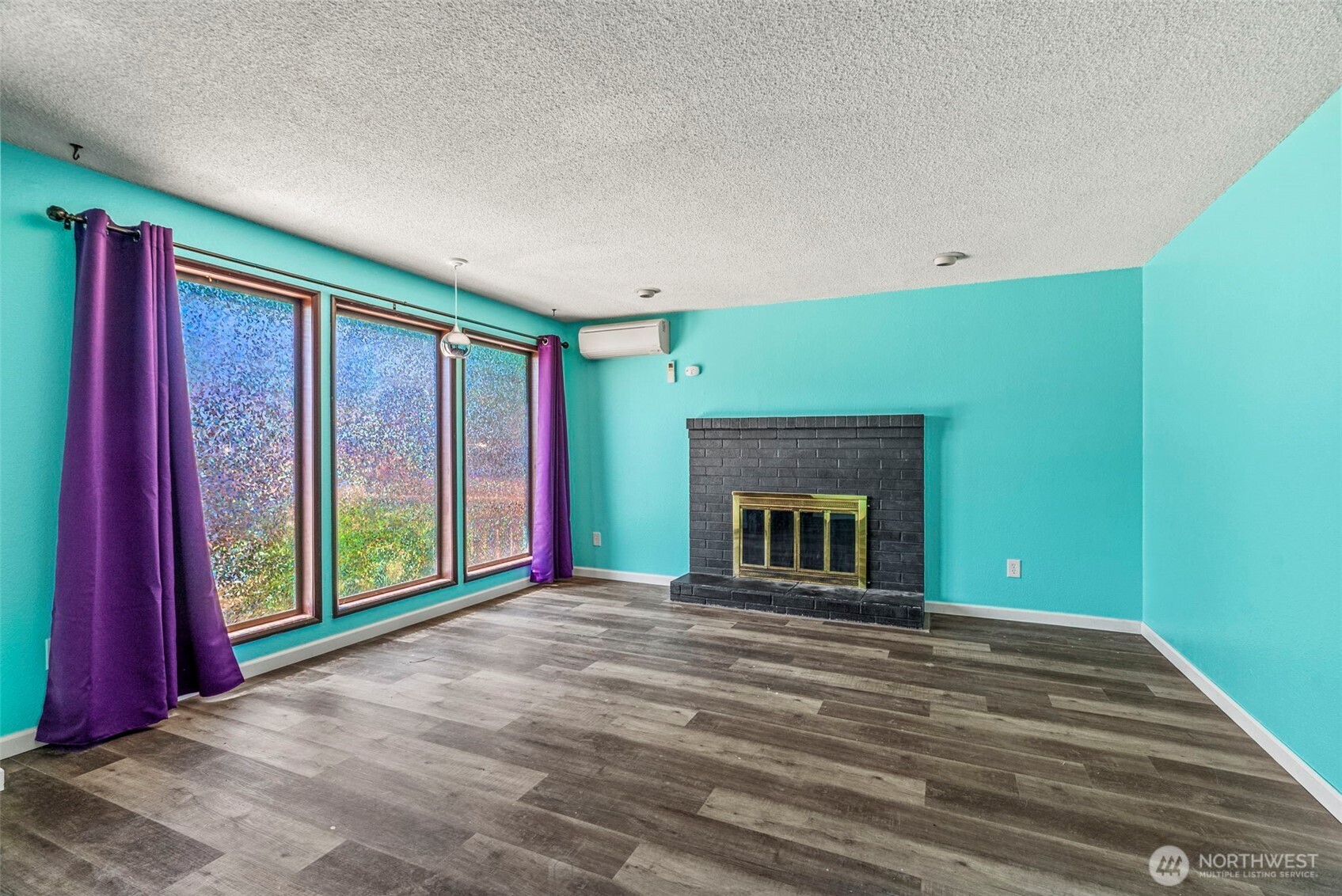 10 Lee Place Longview, WA 98632 - Photo 3 of 27 a view of an empty room with window and fireplace