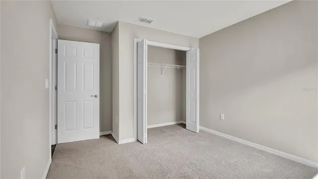 a bathroom with a granite countertop sink a toilet and bathtub