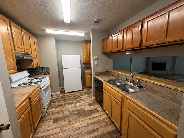 2339 Autumn Springs Lane Spring, TX 77373 - Photo 4 of 12 a kitchen with granite countertop a stove top oven microwave and refrigerator