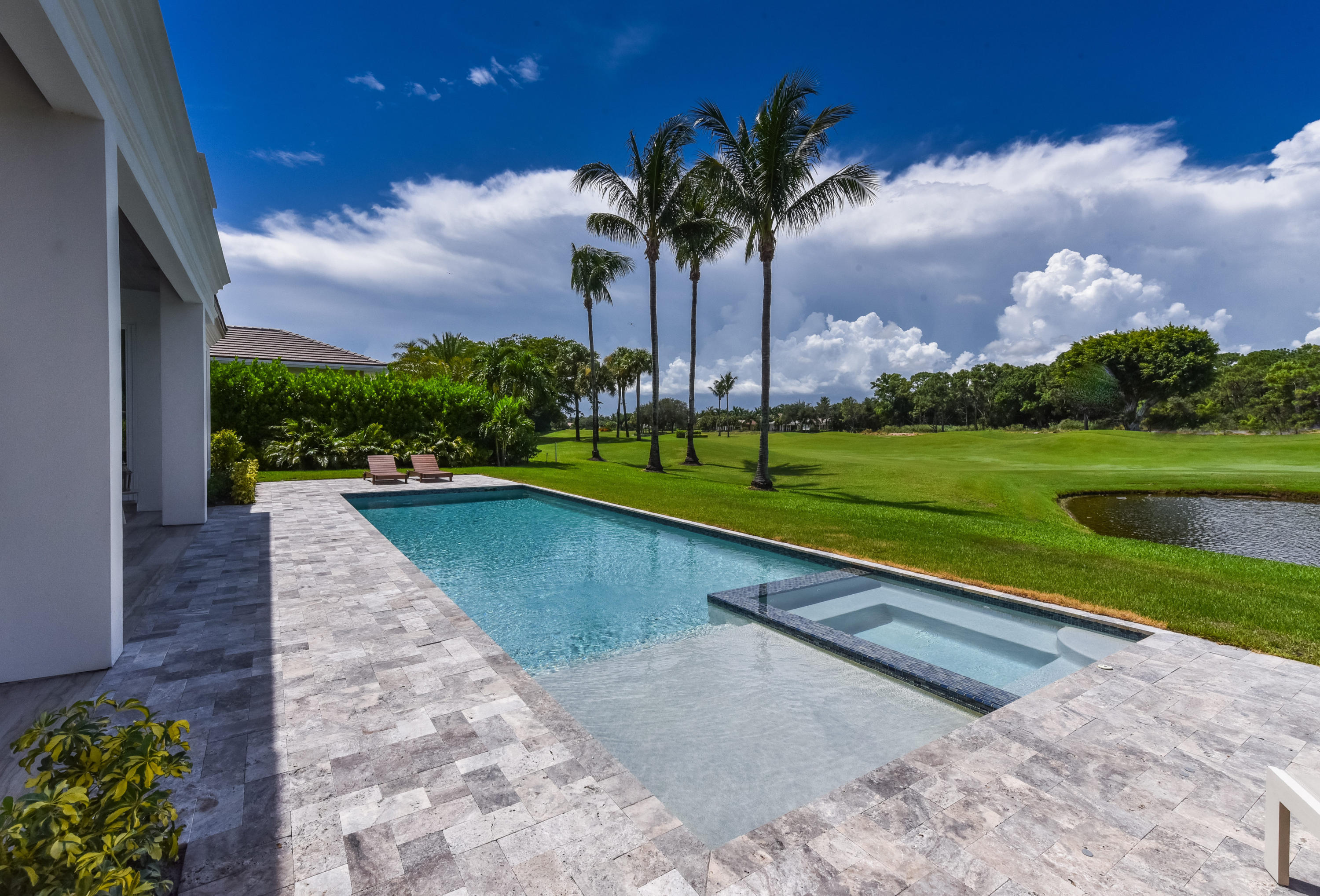 7140 Queenferry Circle Boca Raton, FL 33496 - Photo 14 of 51 a view of swimming pool with a yard and palm trees