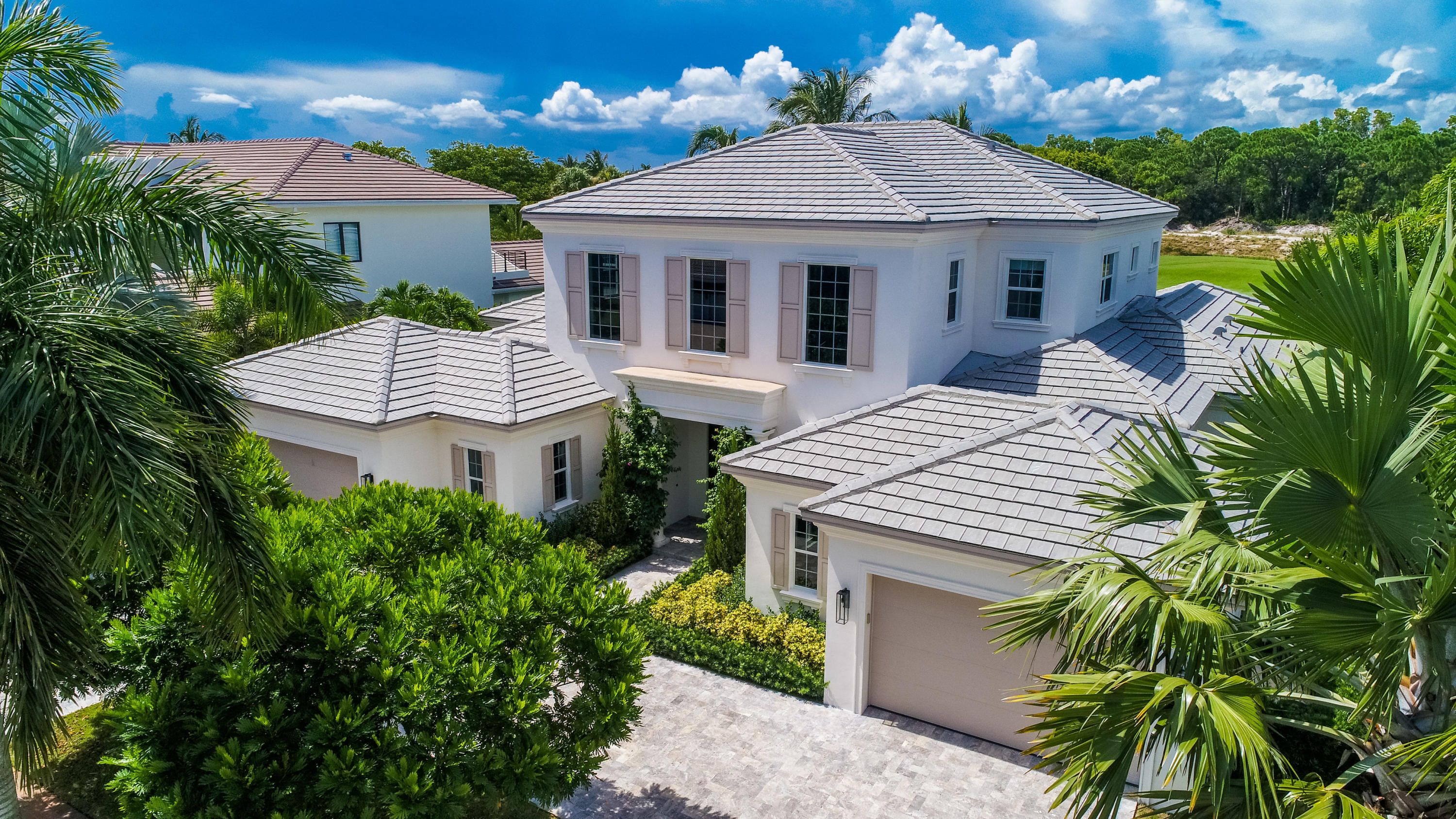 7140 Queenferry Circle Boca Raton, FL 33496 - Photo 3 of 51 a aerial view of a house with a yard and potted plants