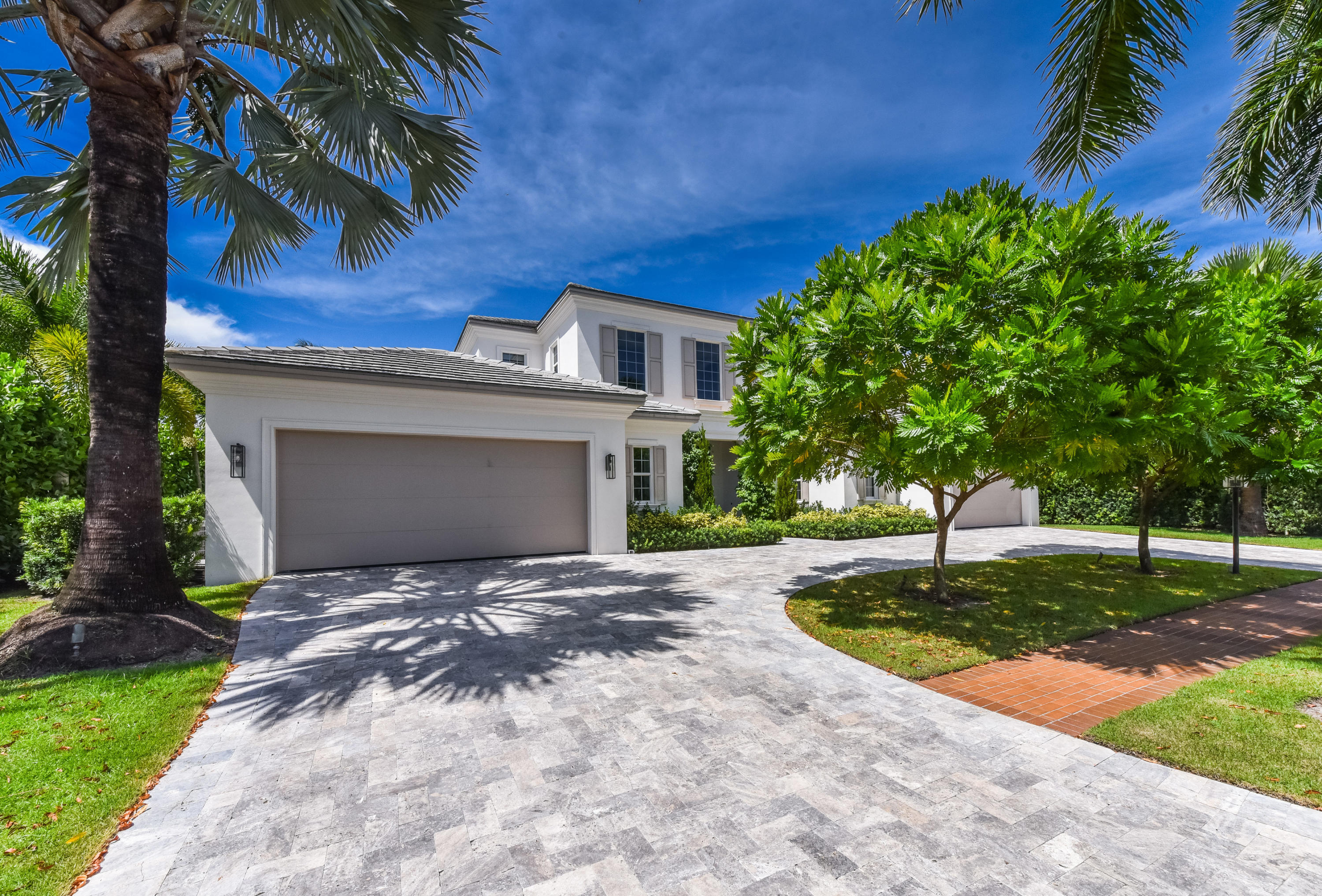 7140 Queenferry Circle Boca Raton, FL 33496 - Photo 4 of 51 a front view of a house with a yard and garage