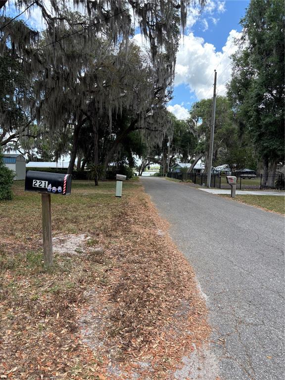 221 South Raven Terrace Inverness, FL 34450 - Photo 2 of 4 a view of a park with a bench and trees