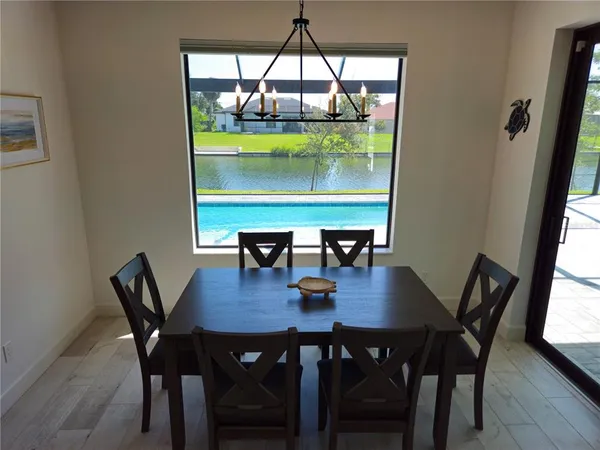 a view of a dining room with tables and chairs
