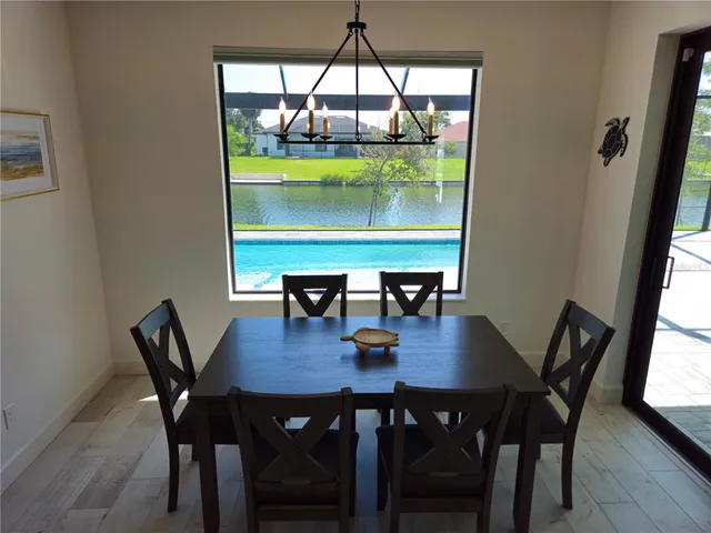 a view of a dining room with tables and chairs