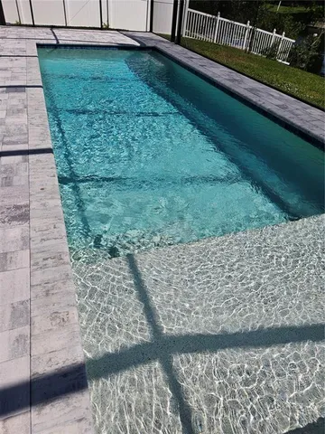 a view of swimming pool with a yard