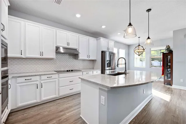 a view of an entryway with wooden floor