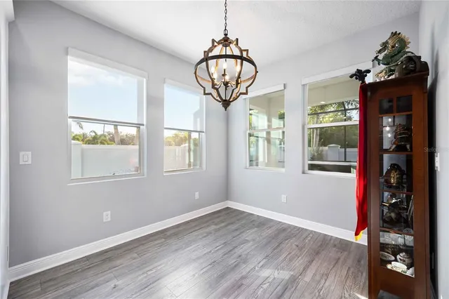 a view of a kitchen with furniture and a window