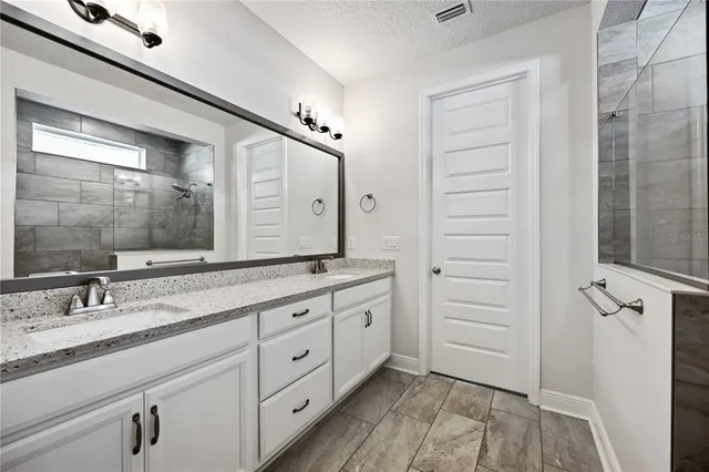 an empty room with wooden floor and window