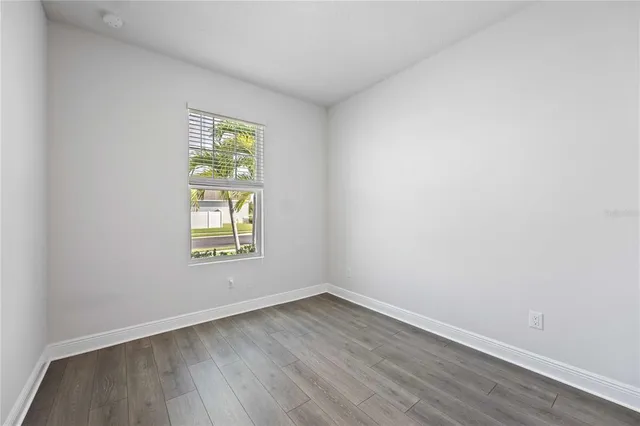 a view of a backyard with a tub and potted plants