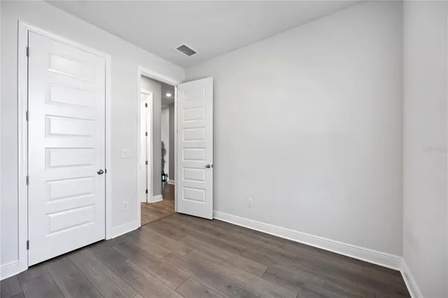 an aerial view of a house with outdoor space patio and lake view