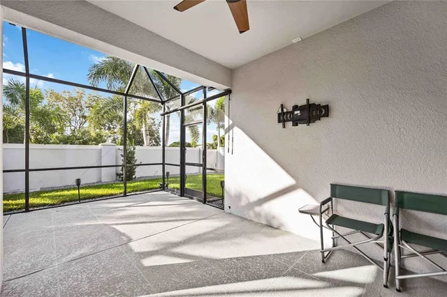 an aerial view of a house with a swimming pool and lake view