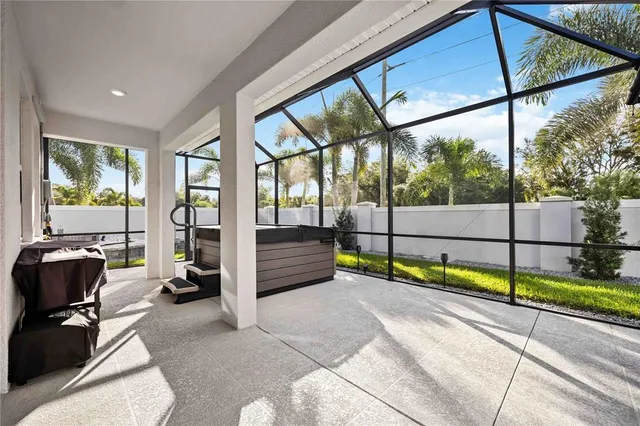 an aerial view of a house with outdoor space and lake view