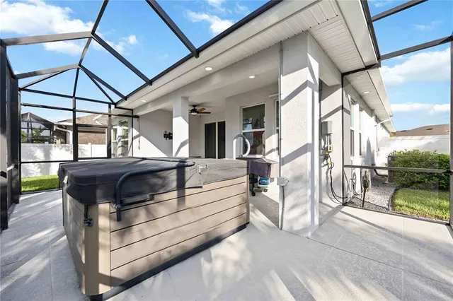 an aerial view of a house with a swimming pool