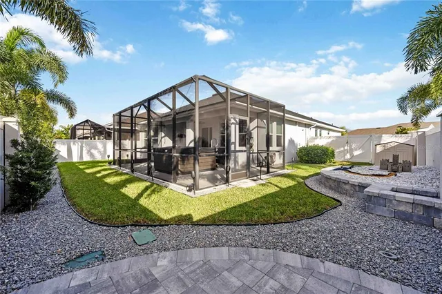 an aerial view of multiple houses with a yard