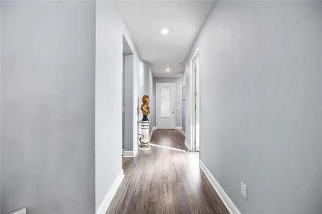 a view of entryway with wooden floor