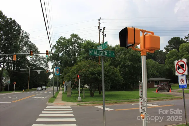 a street sign next to a road