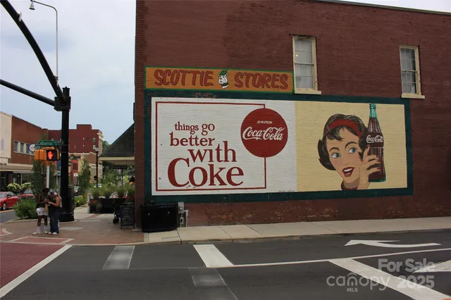 a view of a chairs and table in backyard