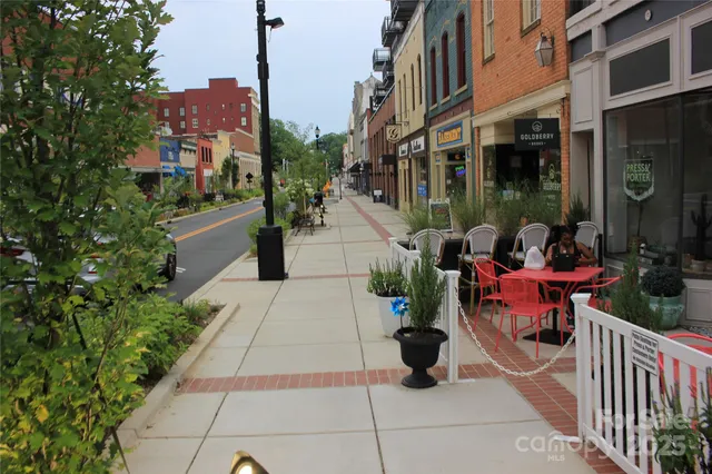 a view of path along with retail shop and buildings
