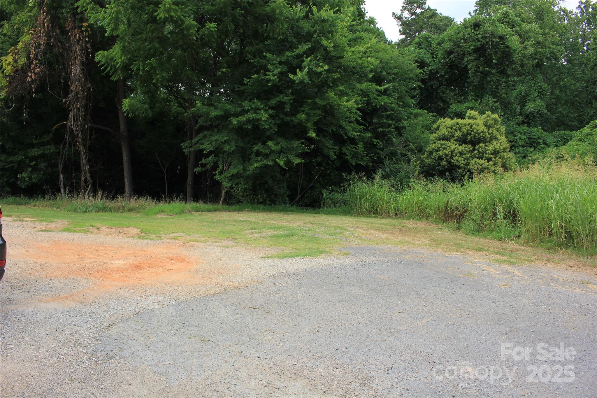 571 Union Street South Concord, NC 28025 - Photo 5 of 34 a view of a field with trees in the background