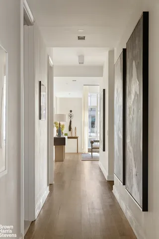 a living room with stainless steel appliances kitchen island granite countertop furniture and a fireplace