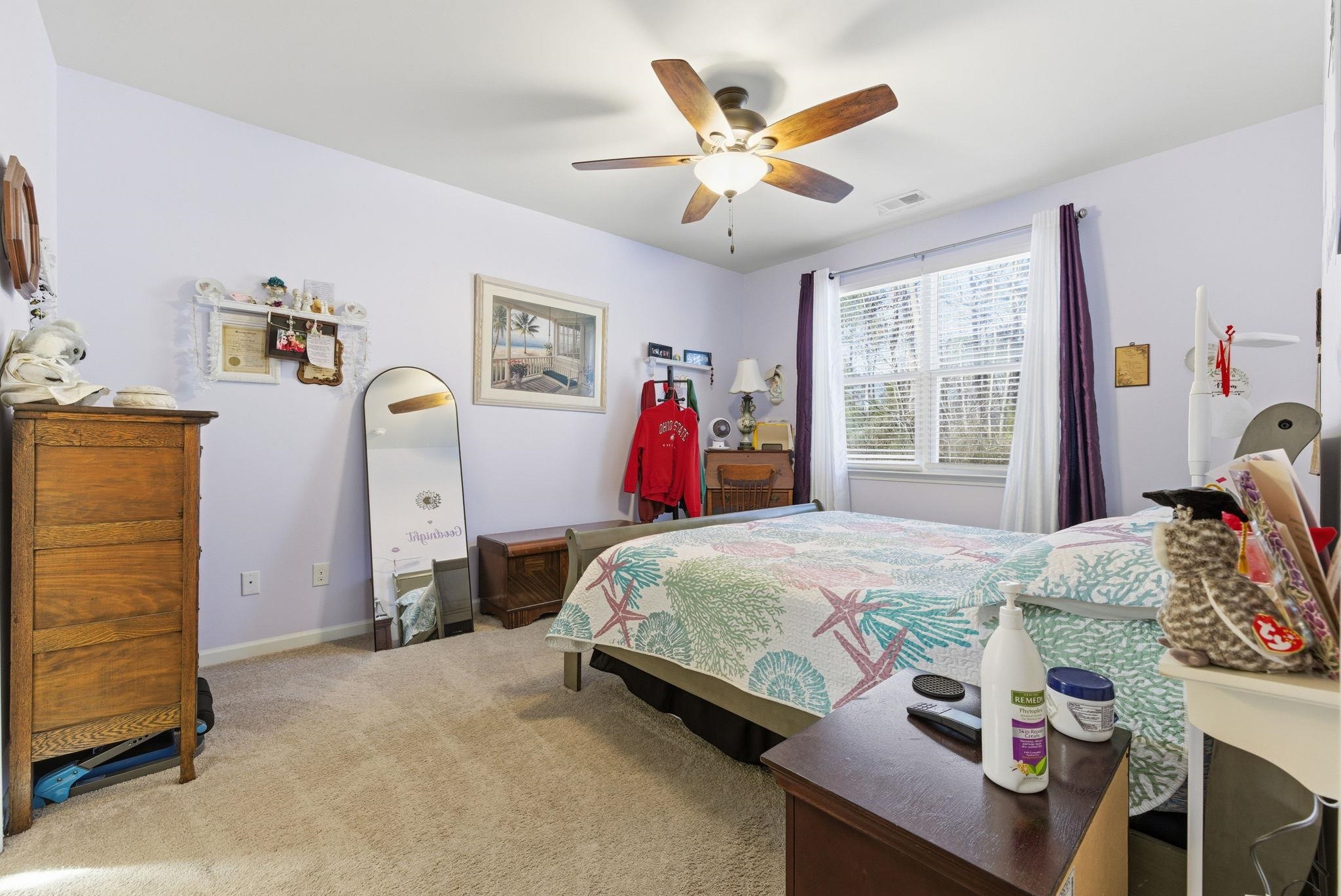 144 Legends Village Loop Myrtle Beach, SC 29579 - Photo 15 of 25 Bedroom with light colored carpet and ceiling fan