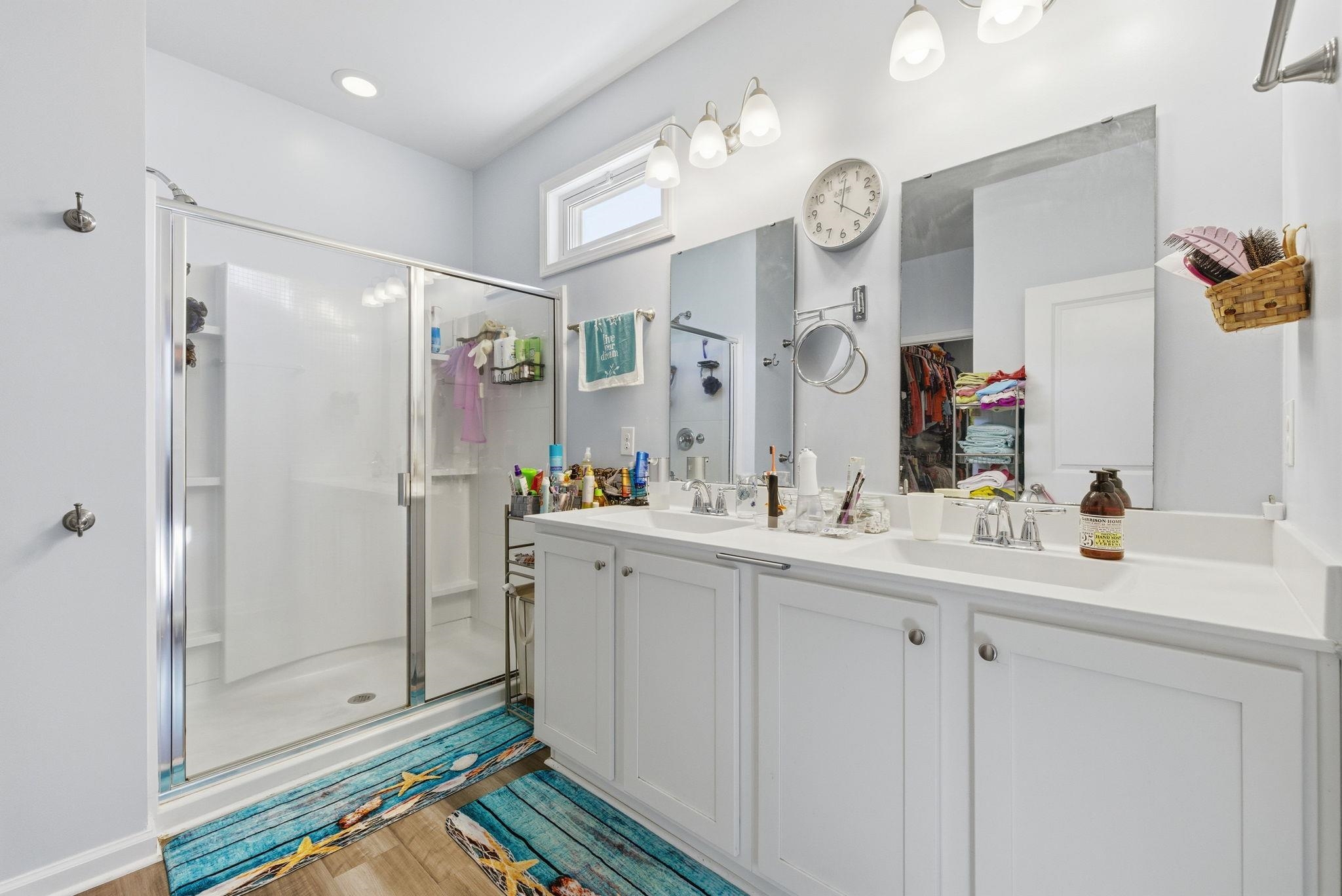 144 Legends Village Loop Myrtle Beach, SC 29579 - Photo 16 of 25 Full bathroom featuring a shower stall, double vanity, a walk in closet, and light wood-style floors