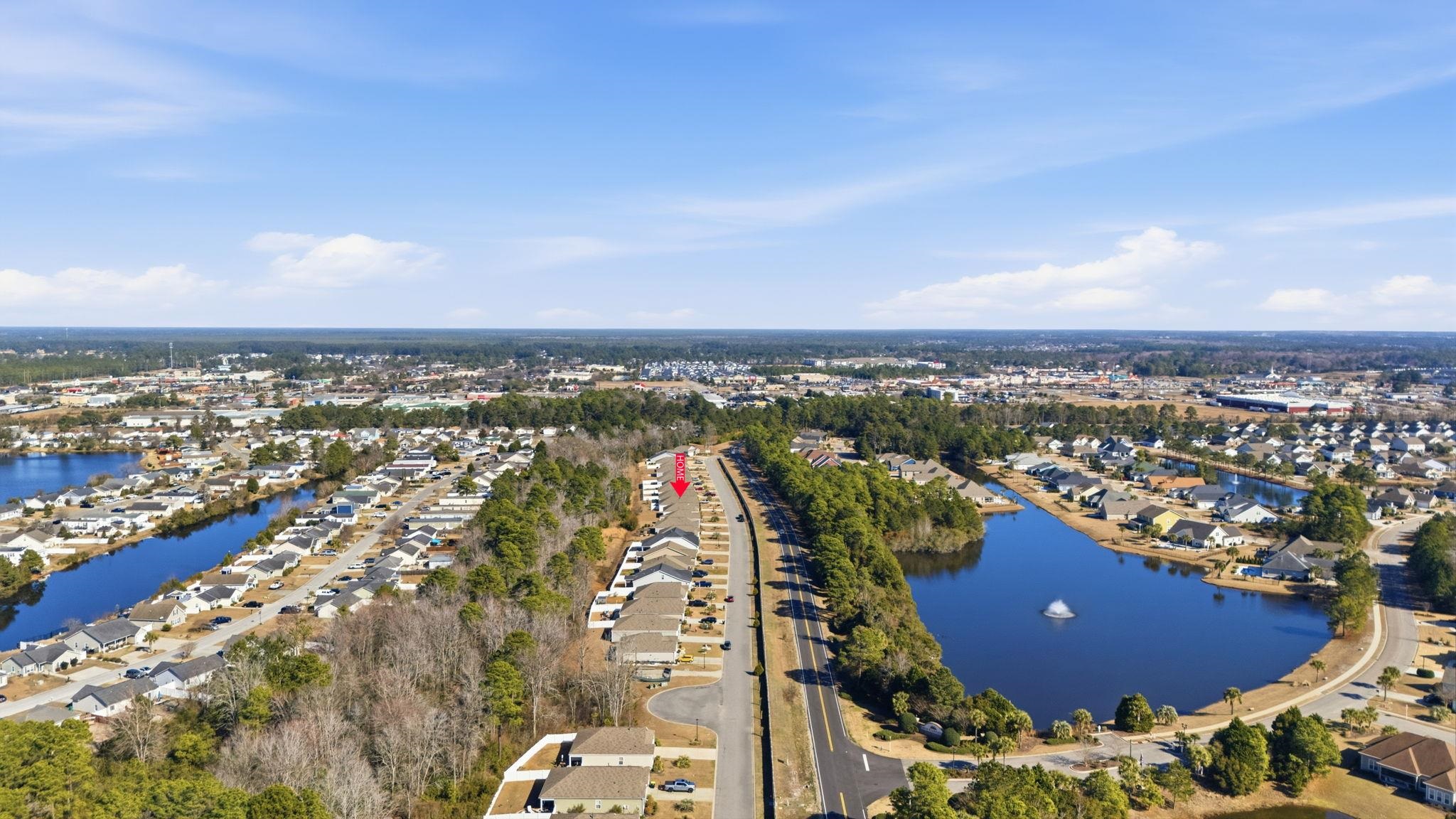 144 Legends Village Loop Myrtle Beach, SC 29579 - Photo 23 of 25 Aerial view of residential area with a large body of water