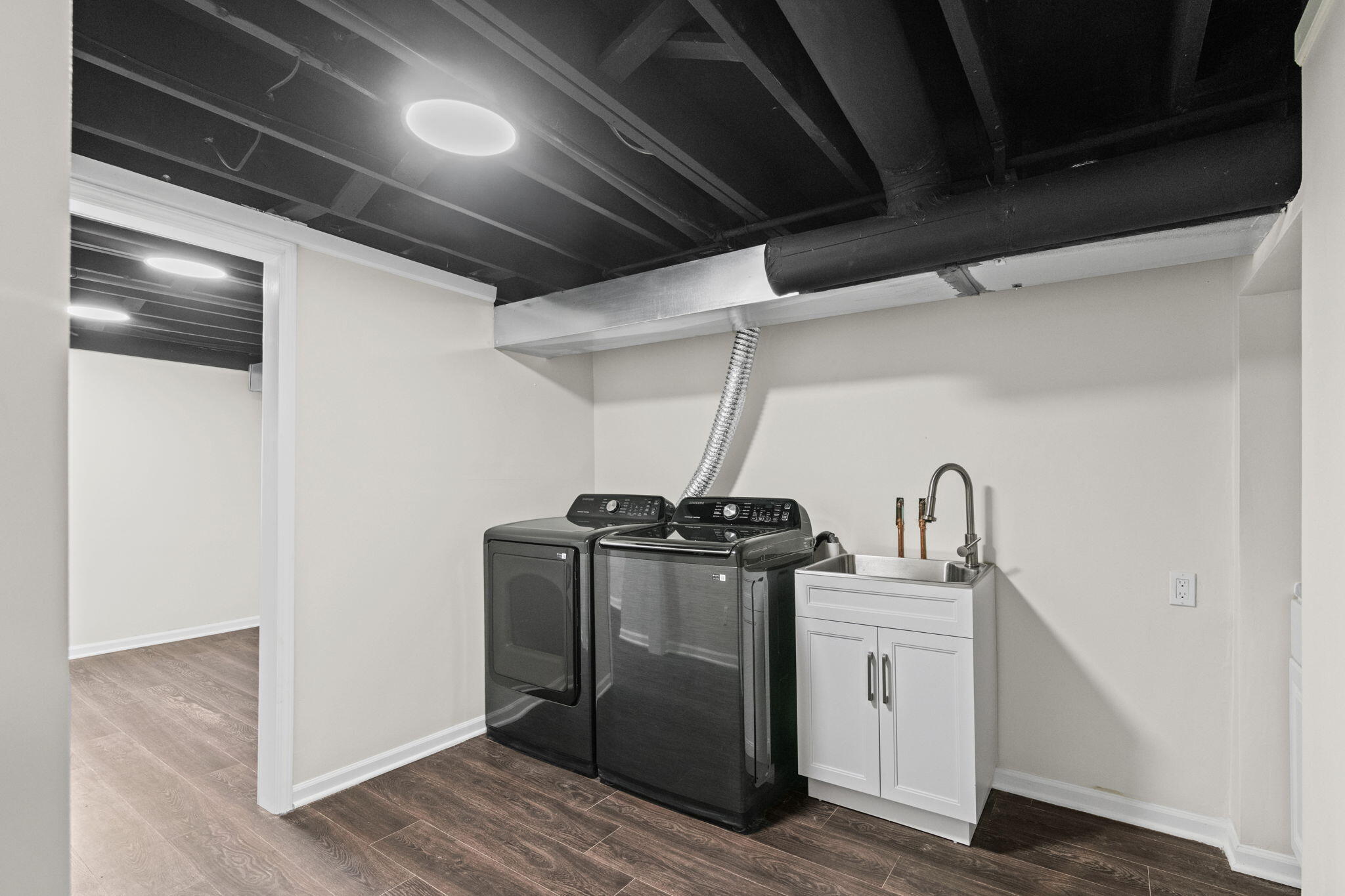 560 Free Church Drive Williams Bay, WI 53191 - Photo 17 of 28 NEW: Laundry Room 12'7x8'10, utility sink plus space for additional shelving and storage.