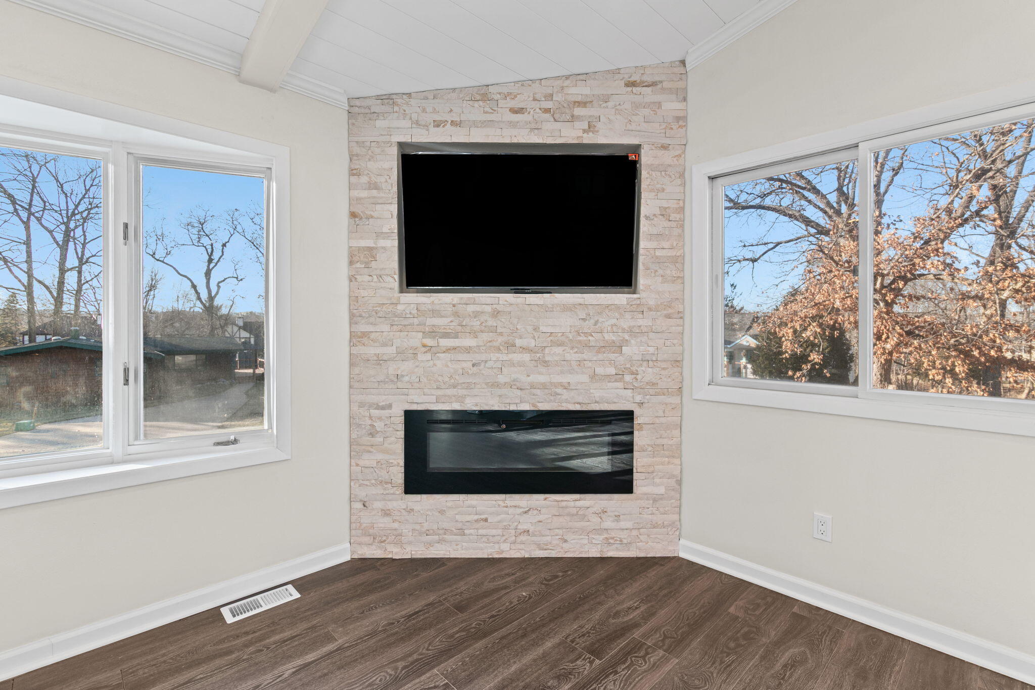 560 Free Church Drive Williams Bay, WI 53191 - Photo 8 of 28 NEW: Electric Fireplace and Flat Screen TV included! Situated in the Northwest corner between the west facing bay window and the north facing picture window. Allowing great filtering of natural light.