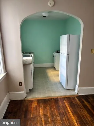 a view of a storage & utility room with a sink