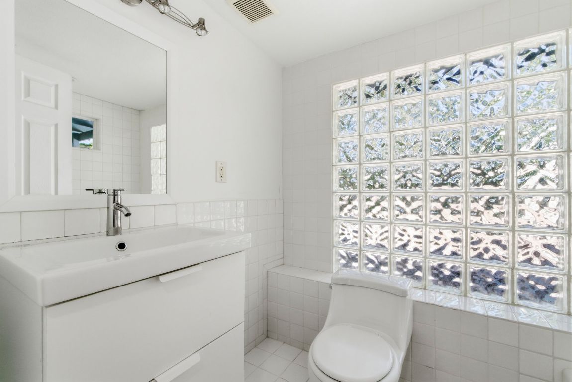 1504 West 39th 1/2 Street Austin, TX 78756 - Photo 16 of 23 a bathroom with a sink toilet and shower