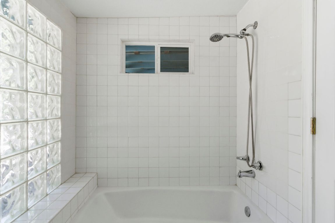 1504 West 39th 1/2 Street Austin, TX 78756 - Photo 17 of 23 a bathroom with a shower and a bath tub