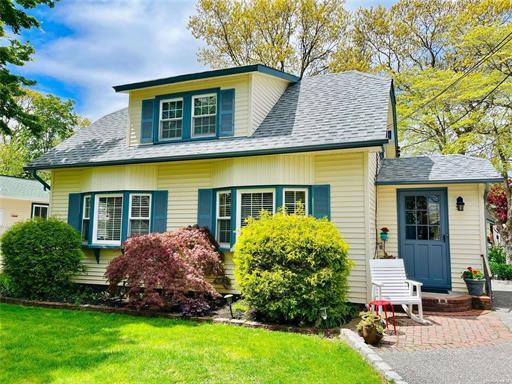 a front view of house with yard and porch