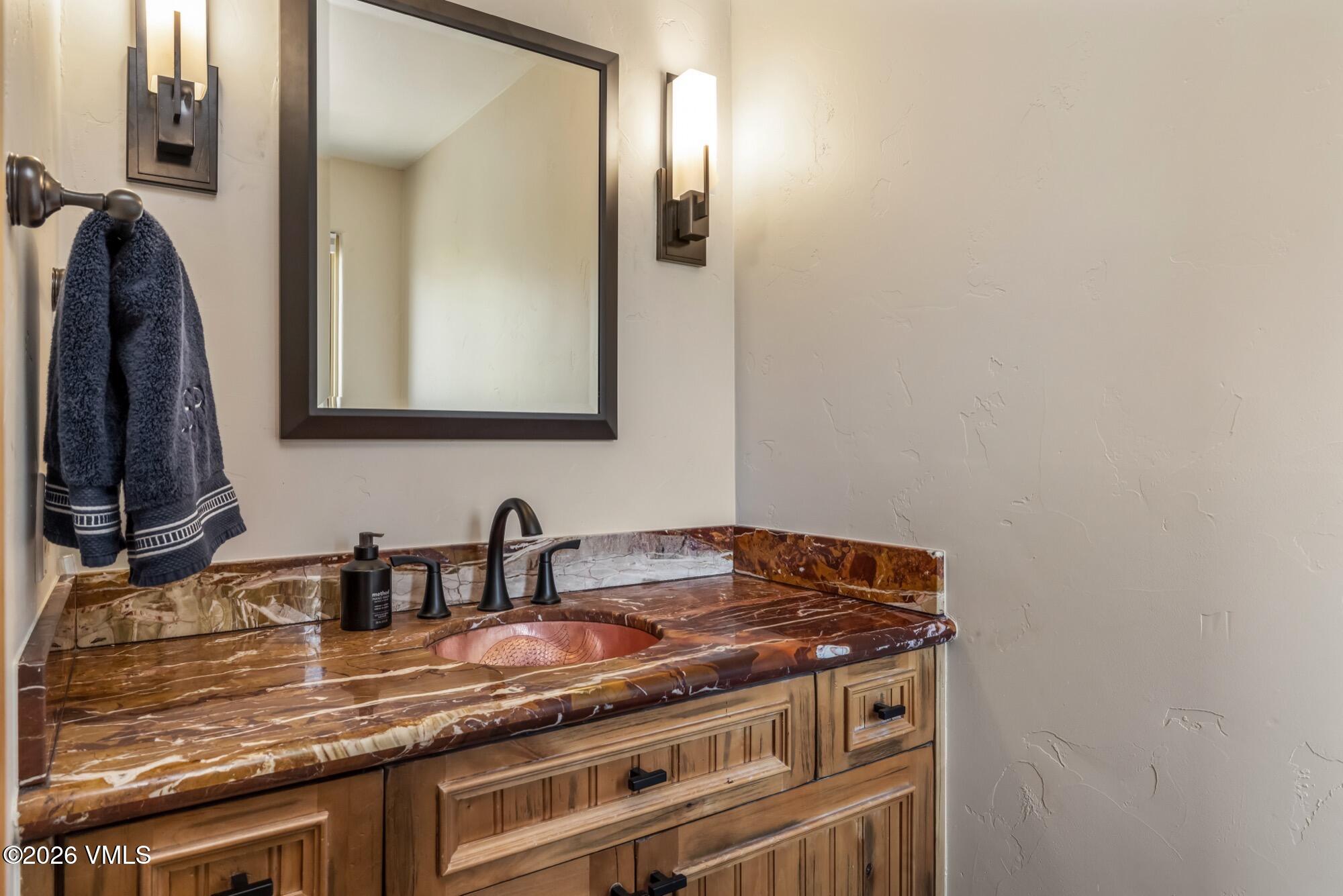 1671 Winslow Road Edwards, CO 81632 - Photo 33 of 48 a view of a sink and a mirror