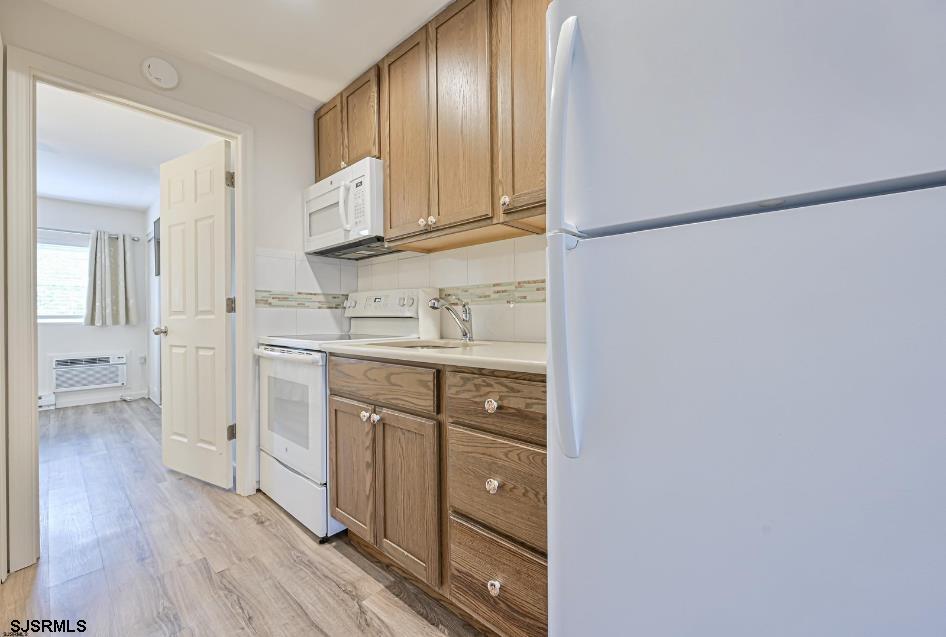 413 East Brigantine Avenue, Unit 28 Brigantine, NJ 08203 - Photo 13 of 20 a kitchen with white cabinets and sink