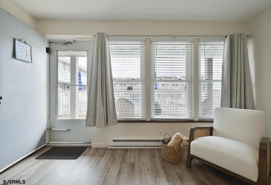 413 East Brigantine Avenue, Unit 28 Brigantine, NJ 08203 - Photo 14 of 20 a living room with furniture and a large window