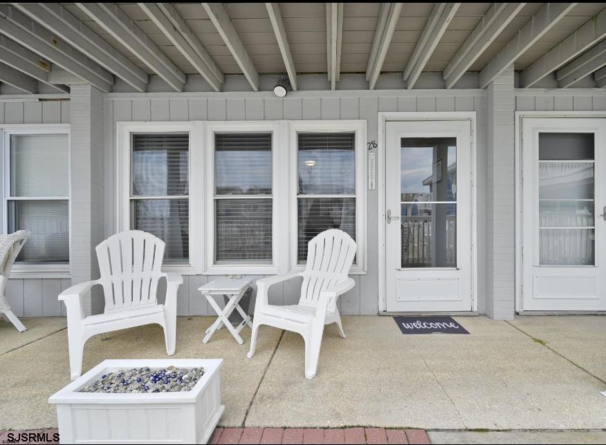 413 East Brigantine Avenue, Unit 28 Brigantine, NJ 08203 - Photo 16 of 20 a front view of a house with outdoor seating