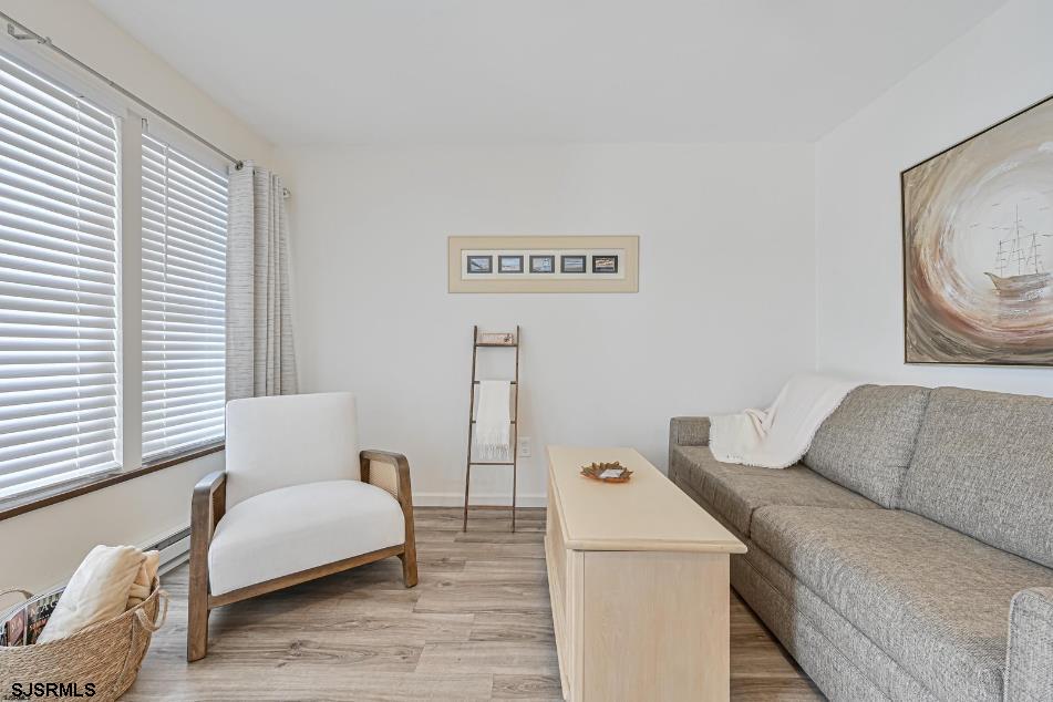 413 East Brigantine Avenue, Unit 28 Brigantine, NJ 08203 - Photo 8 of 20 a living room with furniture and a couch