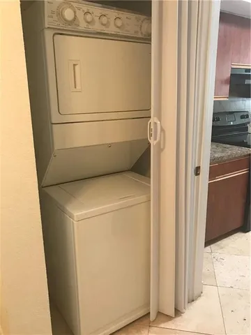 a view of room with window and wooden floor