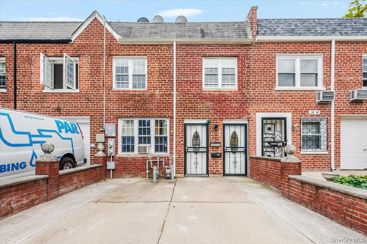 a front view of a house with outdoor space