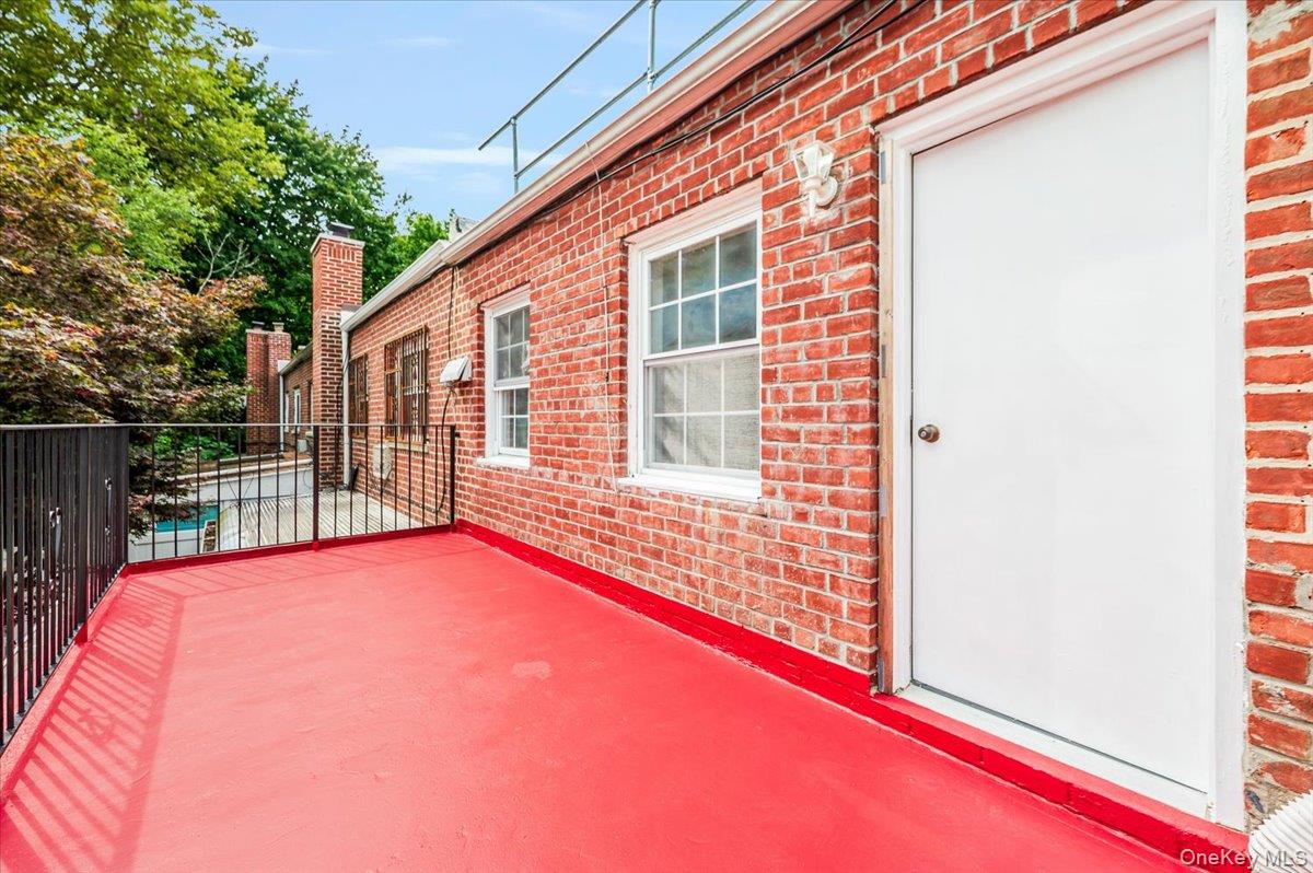 10010 133rd Avenue Queens, NY 11417 - Photo 12 of 22 a view of a backyard with a small cabin