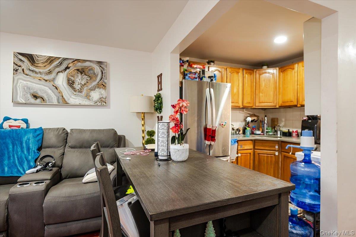 10010 133rd Avenue Queens, NY 11417 - Photo 21 of 22 a living room with furniture and wooden floor
