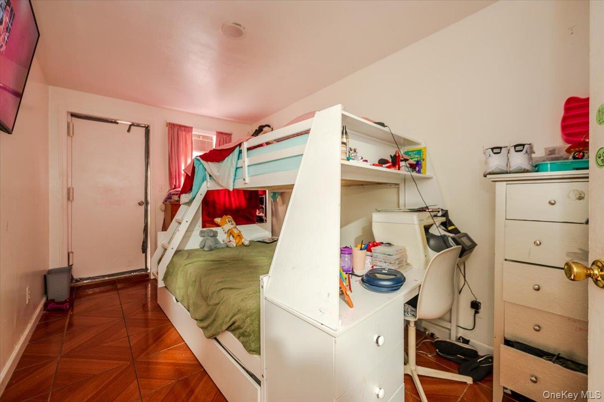 10010 133rd Avenue Queens, NY 11417 - Photo 17 of 22 a view of walk in closet with clothes and shoes