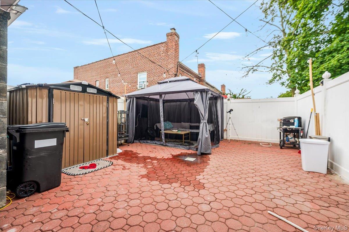 10010 133rd Avenue Queens, NY 11417 - Photo 19 of 22 a view of a house with a patio