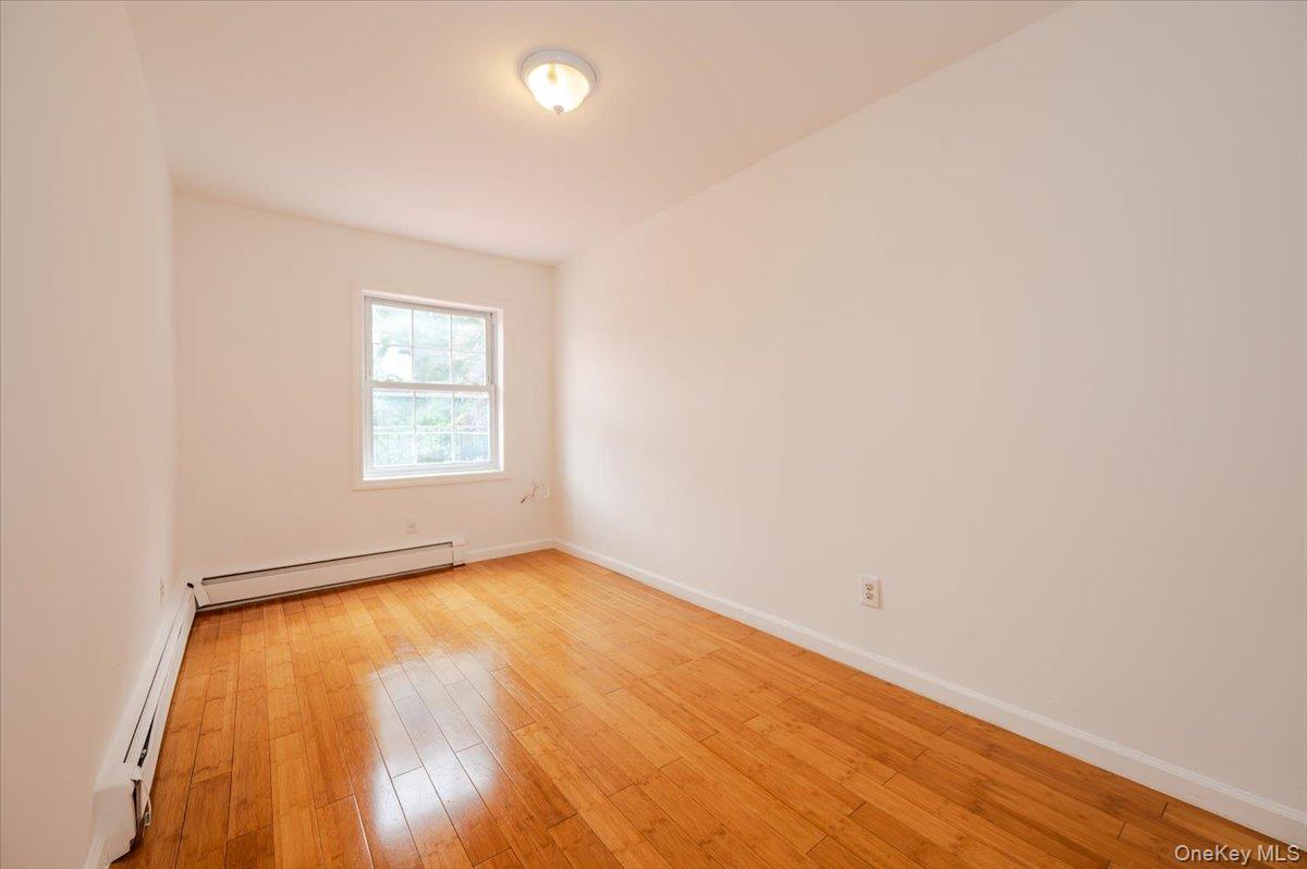 10010 133rd Avenue Queens, NY 11417 - Photo 7 of 22 an empty room with windows