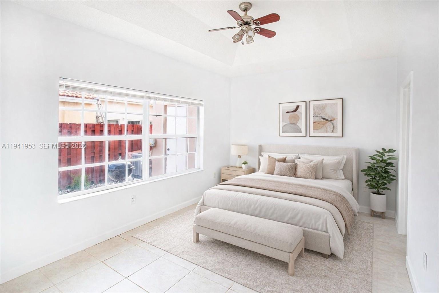 16222 Southwest 102nd Terrace Miami, FL 33196 - Photo 18 of 32 a bedroom with a bed and a window